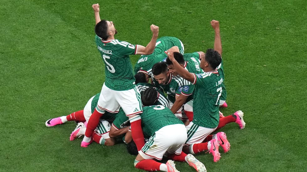 Mexico's Raul Jimenez (9) celebrates with teammates after scoring their second goal during the...