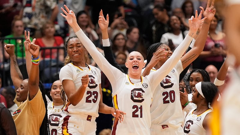 South Carolina guard Bree Hall (23), forward Chloe Kitts (21) and forward Sania Feagin (20)...