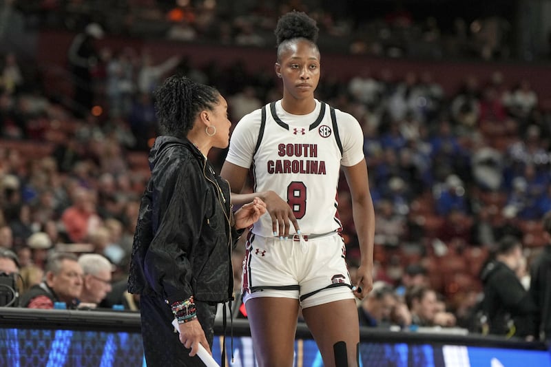 South Carolina head coach Dawn Staley talks with forward Joyce Edwards (8) during an NCAA...