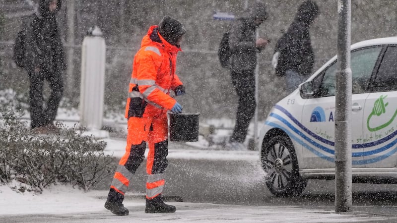 FILE - Salt is spread on a street in Gelsenkirchen, Germany, Jan. 7, 2026.