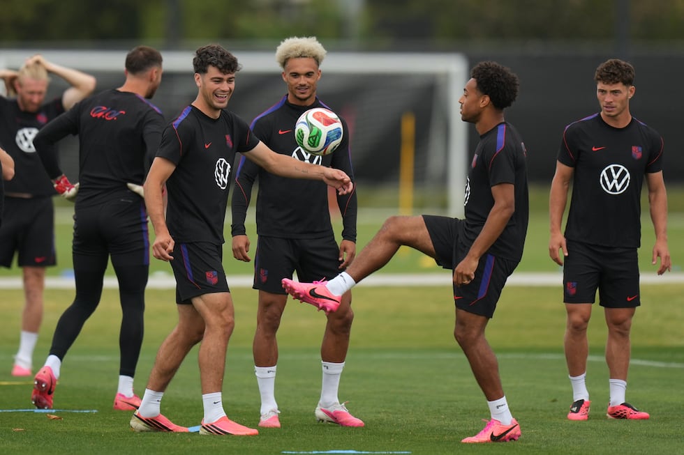 United States' Giovanni Reyna, center left, Antonee Robinson, center, and Tyler Adams practice...
