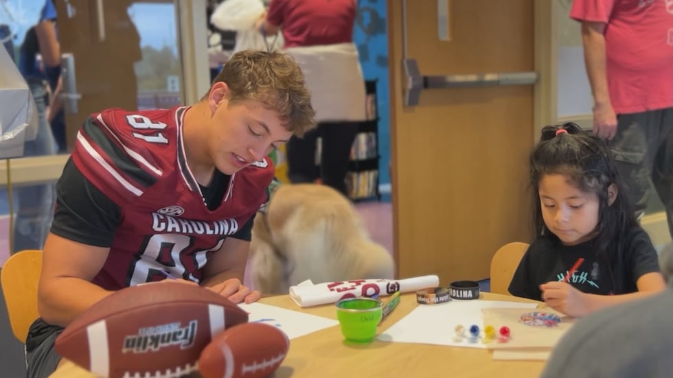 Aaron Morton spends time with a patient at Prisma Health Children’s Hospital-Midlands