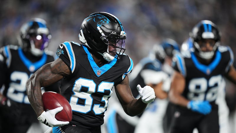 Carolina Panthers wide receiver David Moore (83) runs the ball during an NFL football game...
