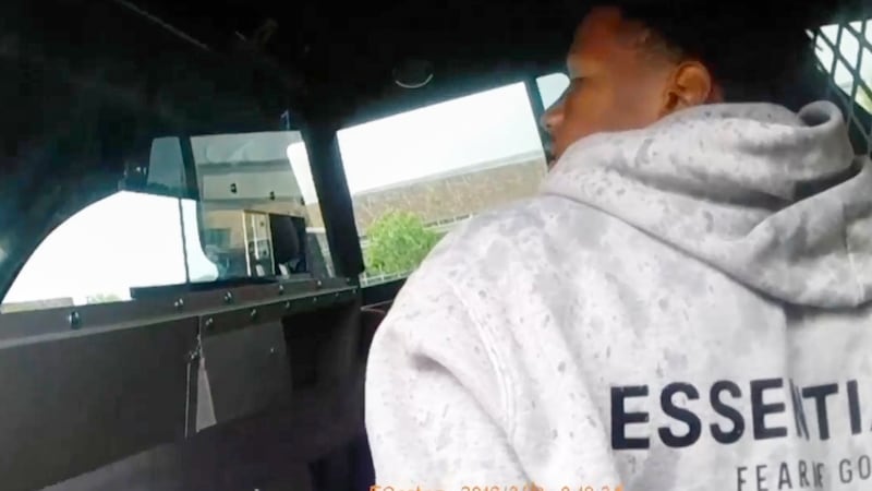 In this image taken from Frisco Police Department body camera footage, an officer arrests...