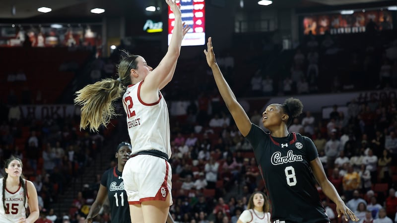 Oklahoma guard Payton Verhulst (12) shoots over South Carolina forward Joyce Edwards (8)...