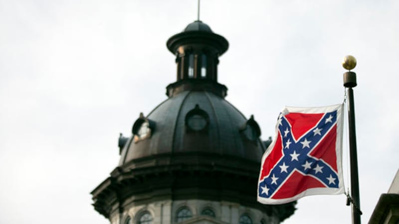 A Confederate battle flag flies in front of the South Carolina statehouse Wednesday, July 8,...