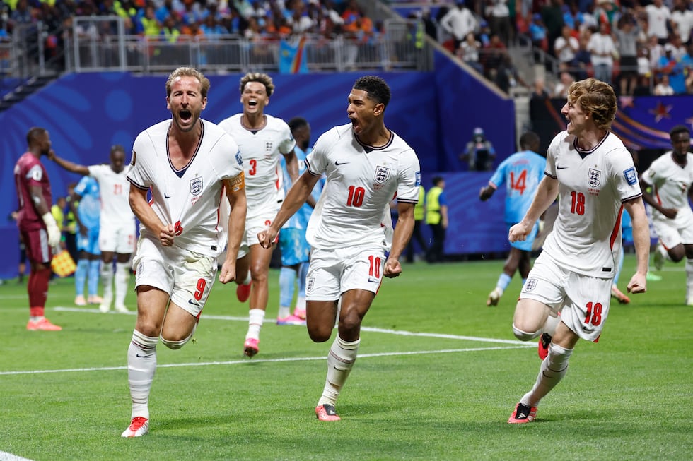 England's Harry Kane (9) celebrates after scoring his side's first goal next to his teammate...