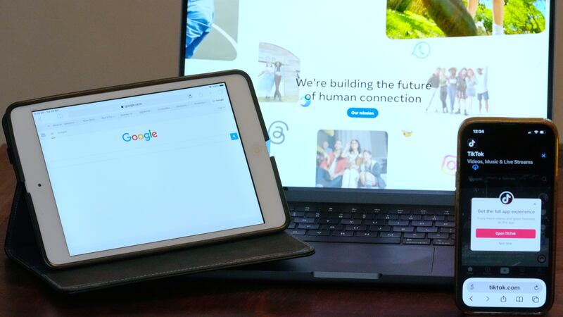 The home pages of Meta, Google and TikTok are displayed on devices in Sydney, Tuesday, April...
