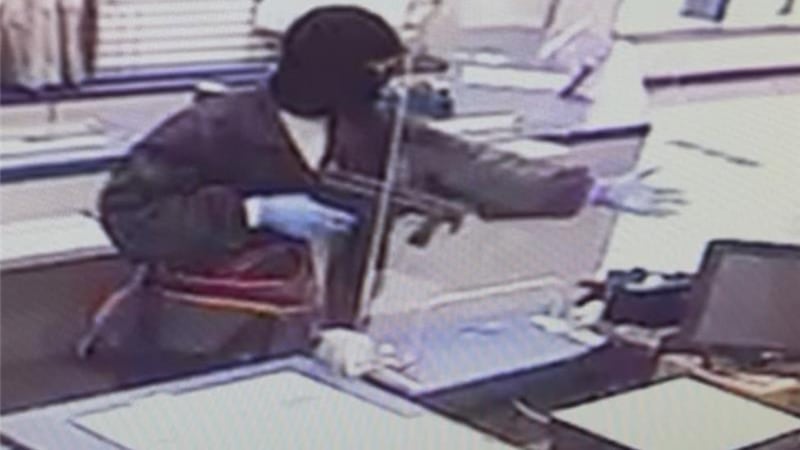 Columbia post office robbed at gunpoint, suspect wanted